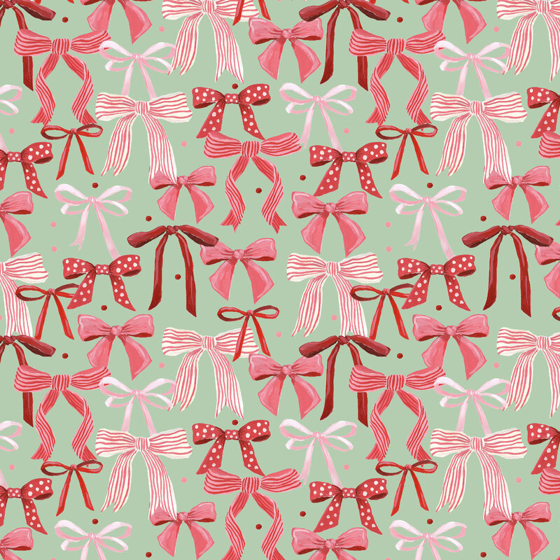Mint green fabric with tossed watercolor bows and ribbons in pink and red.