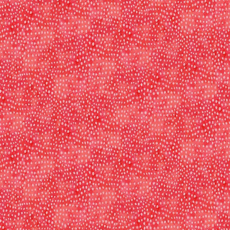 Mottled red fabric with white dotted accents to emulate a seed-like texture