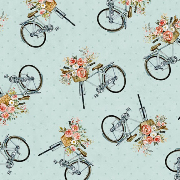 This cottage blue polka dot fabric features vintage bicycles with their baskets filled with pink watercolor florals. 