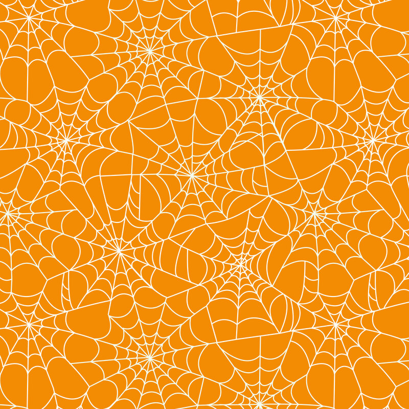A light orange fabric with spider webs.