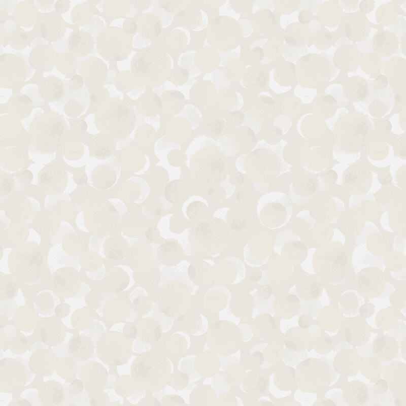 a cream fabric with scattered dots.