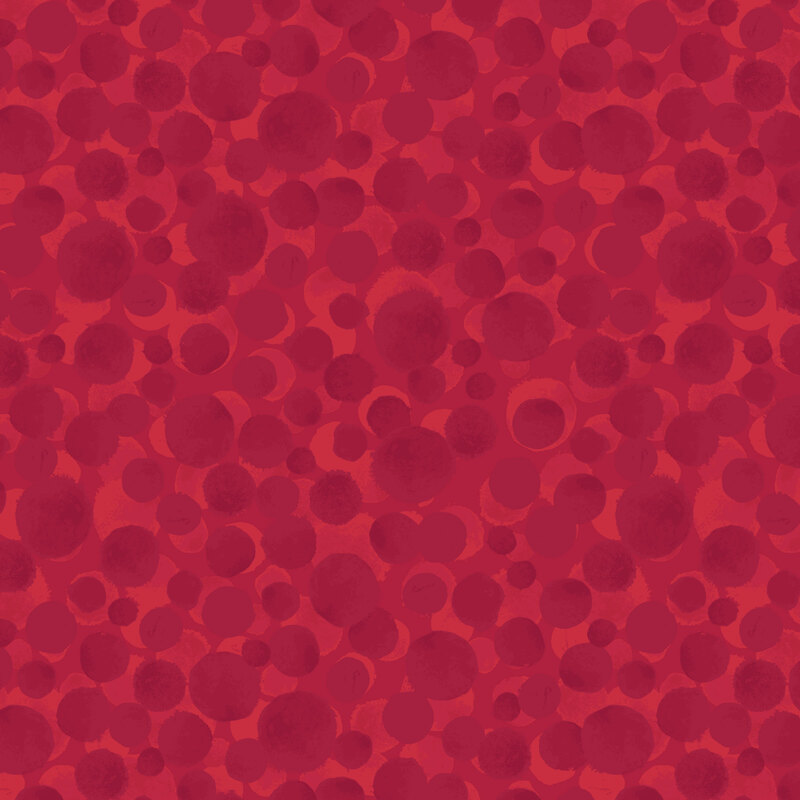 A cranberry red fabric with scattered dots.
