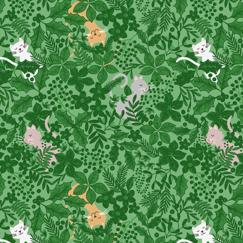 A pistachio green fabric with cats nestled in dense green Christmas foliage.