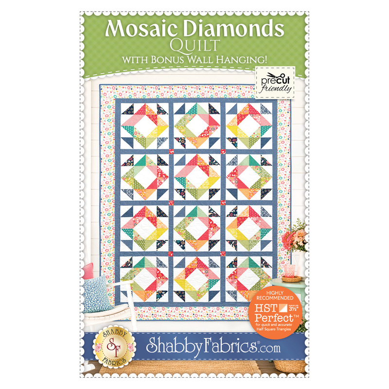 The front cover of the Mosaic Diamonds pattern showing the completed quilt colored in a rainbow of fabrics, staged on a white wall with coordinating furniture and décor.