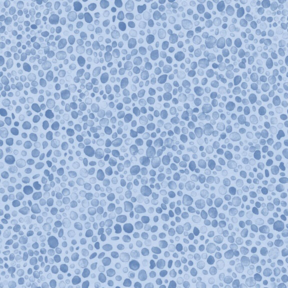 light blue fabric with a textured pebble print in tonal blue hues.