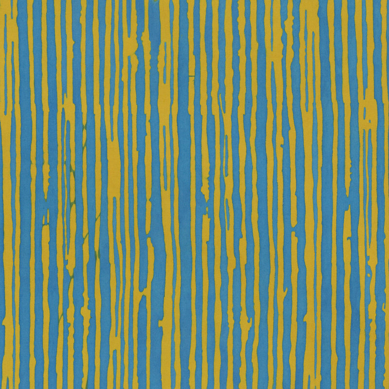 A brass batik fabric featuring irregular teal blue vertical stripes.