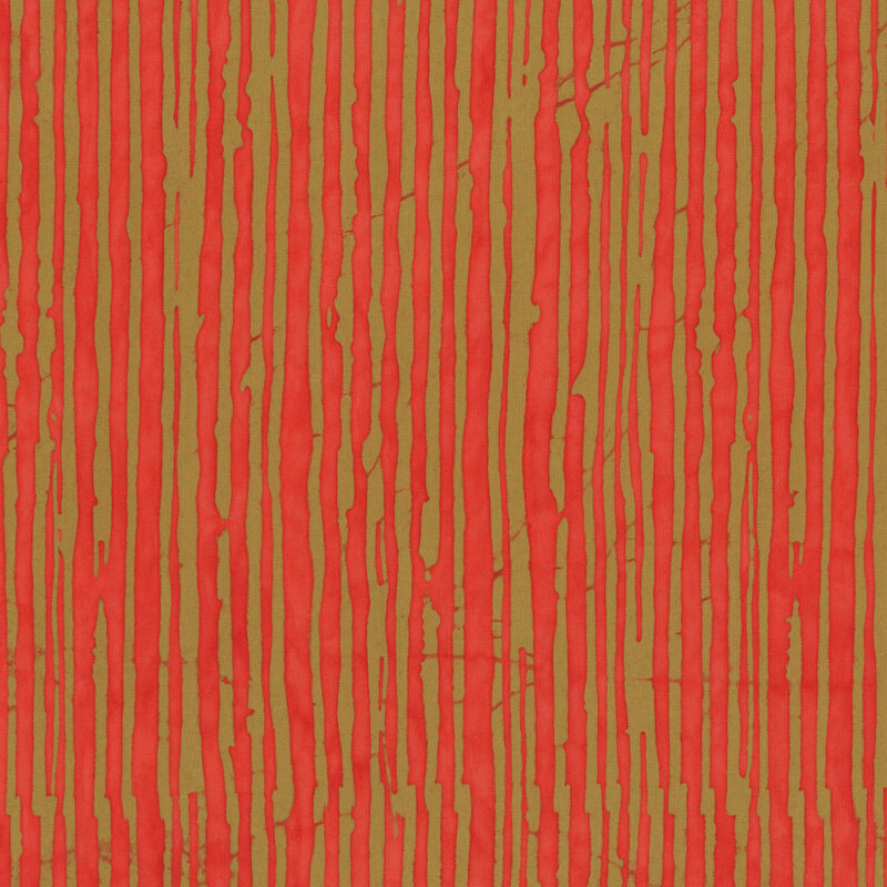 A coral red batik fabric featuring irregular olive brown vertical stripes.
