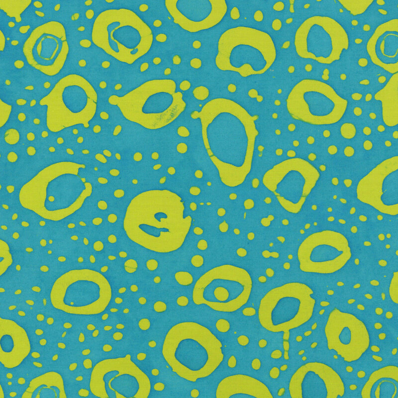 Aqua blue fabric with irregular stamped circles and dots in lime green.