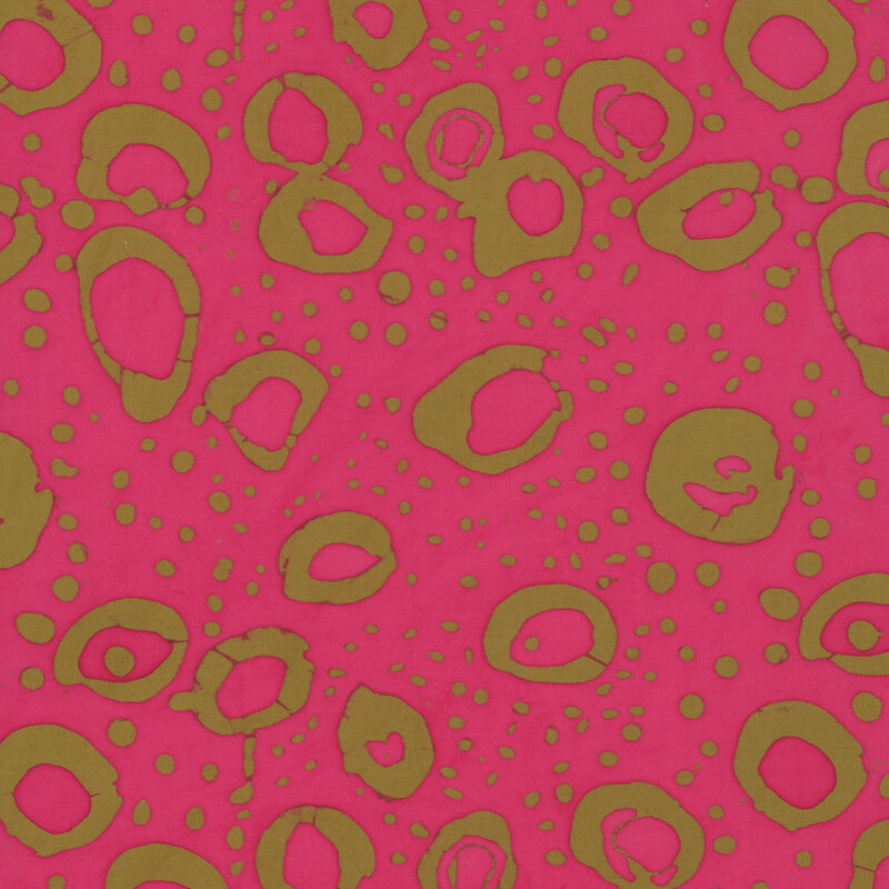 Hot pink fabric with irregular stamped circles and dots in ocher.