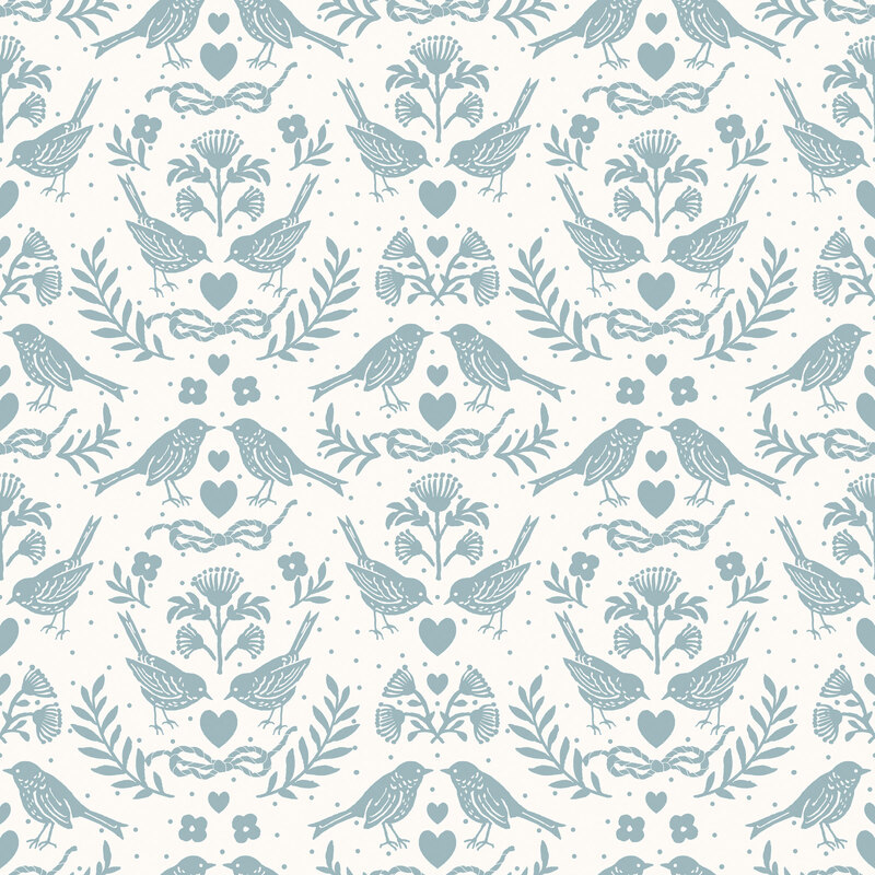 A white fabric featuring blue-gray birds, flowers, leaves, hearts, and rope bows. 