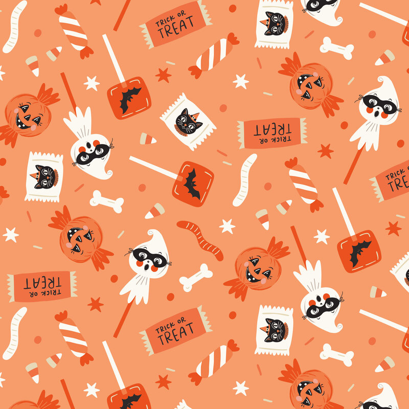 A persimmon fabric with scattered candies. 