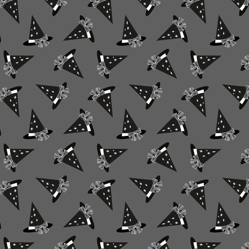 A charcoal fabric with tossed black witch hats. 