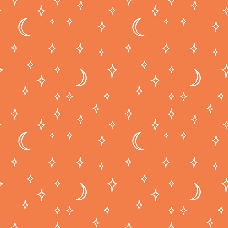 A persimmon fabric with scattered moons and stars. 
