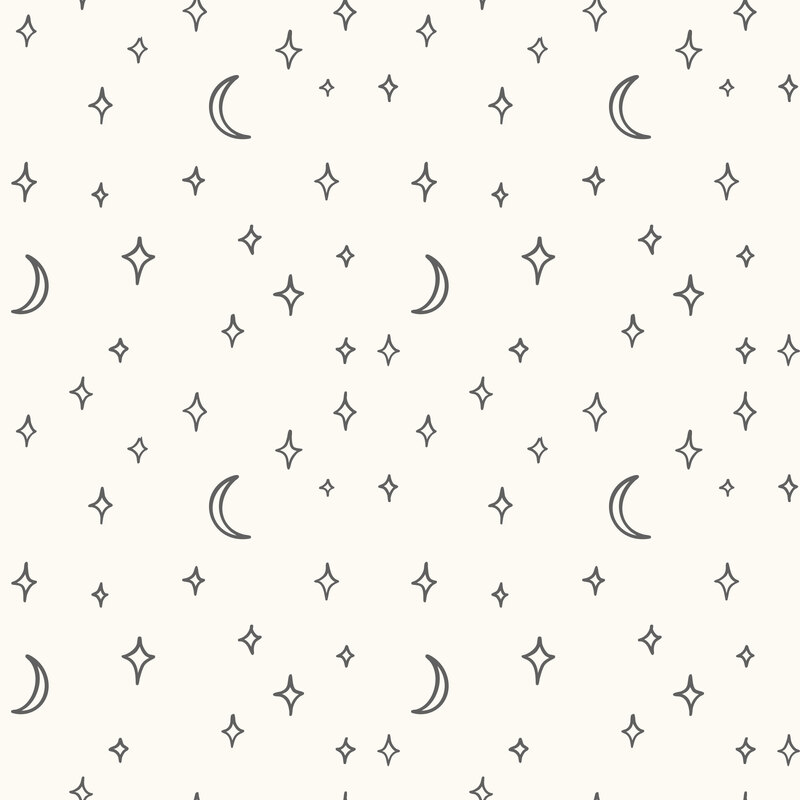 A white fabric with charcoal moons and stars. 