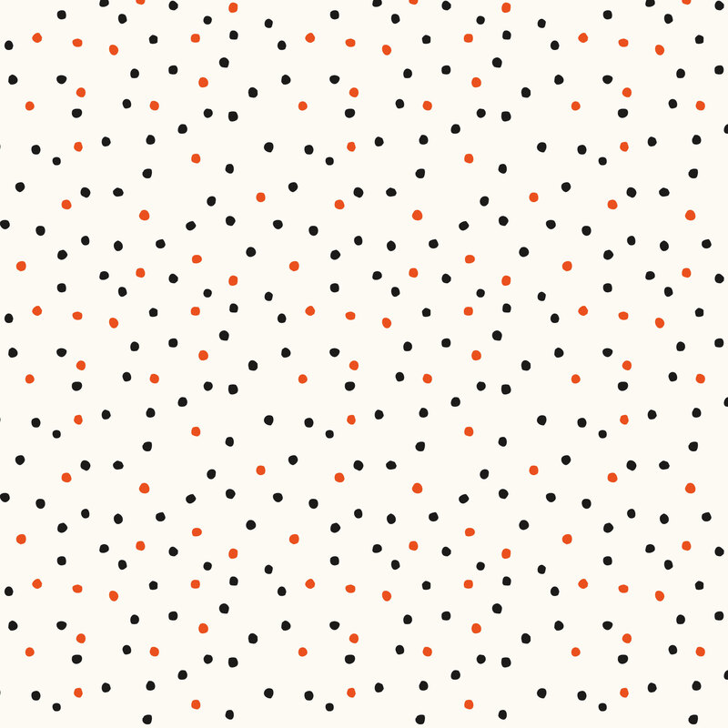 A white fabric with black and bright orange dots. 