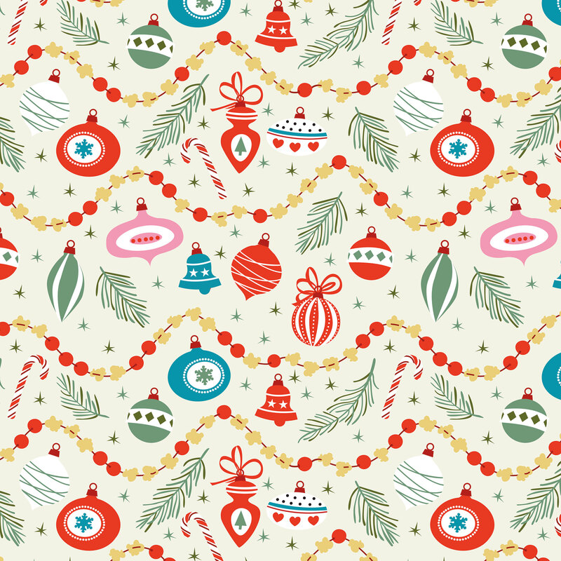 Cream fabrics scattered with pine sprigs, Christmas ornaments, stars, and ornament strings.