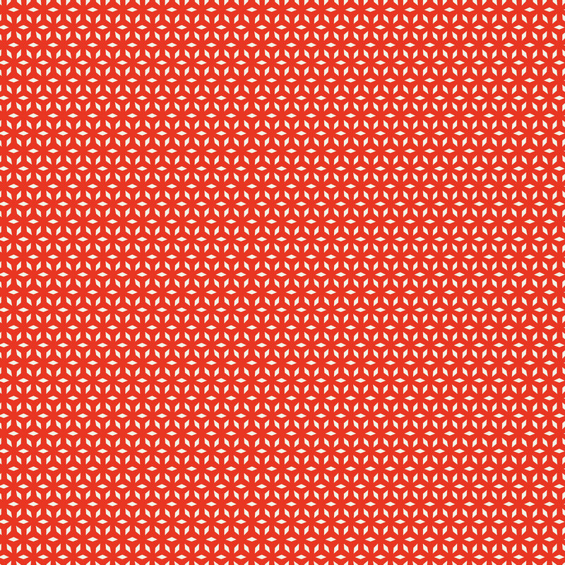 Red fabric with a white geometric snowflake pattern.
