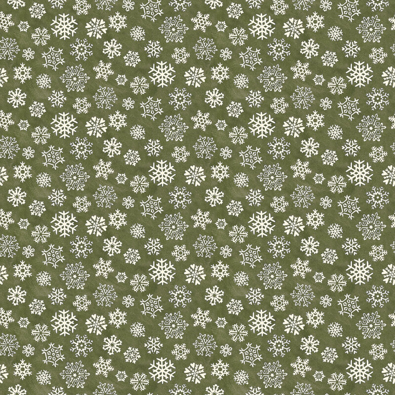 Mottled avocado green fabric with a tight, tossed design of white snowflakes.