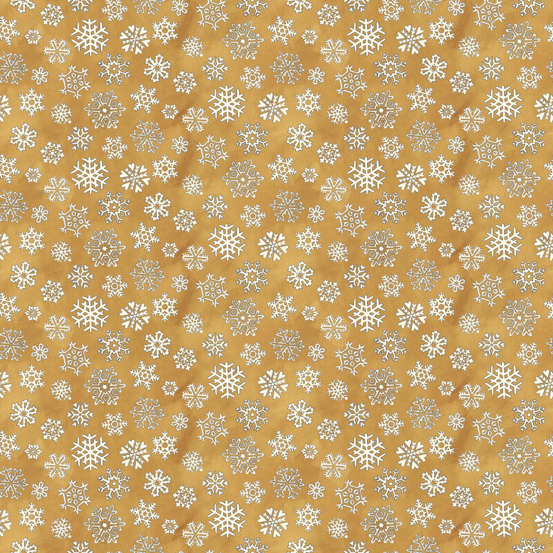Mottled gold fabric with a tight, tossed design of white snowflakes.