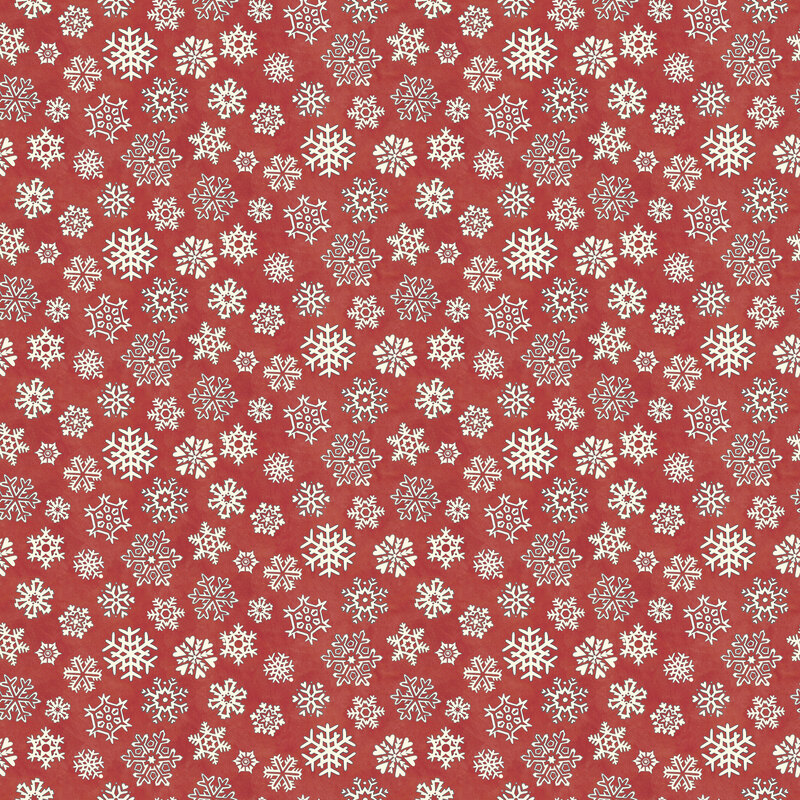Mottled red fabric with a tight, tossed design of white snowflakes.