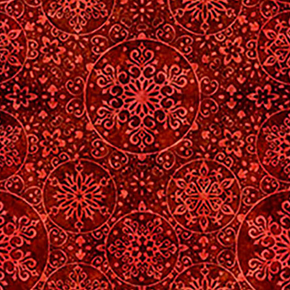 A Christmas red fabric with intricate snowflake medallions. 
