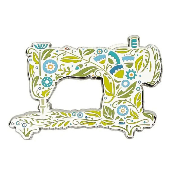 blue, teal, and green floral sewing machine magnetic needle minder, isolated on a white background.