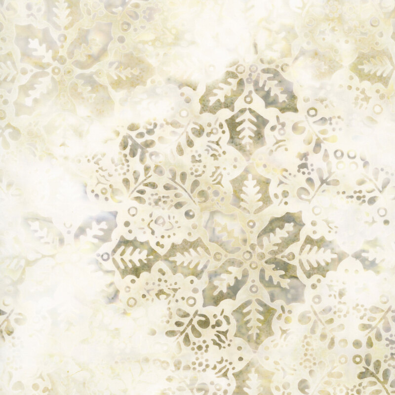 This cream batik fabric features cream and beige holly leaves and springs in a repeating geometric design. 