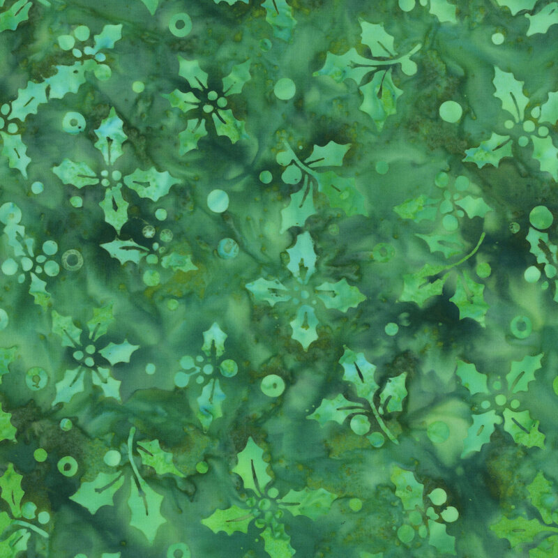 This christmas green batik fabric features tonal holly sprays and tosses dots. 