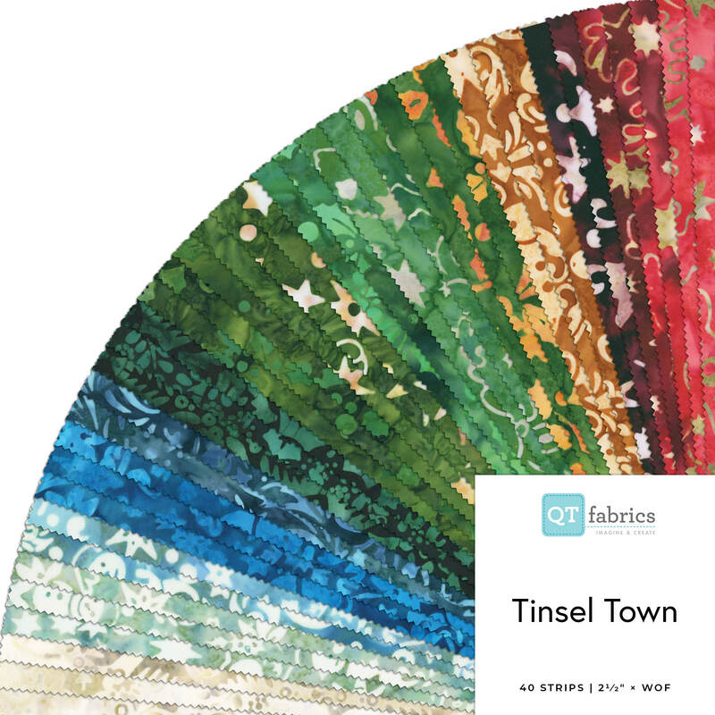 A fanned fabric collage featuring Christmas Batik from Tinsel Town by QT Fabrics.