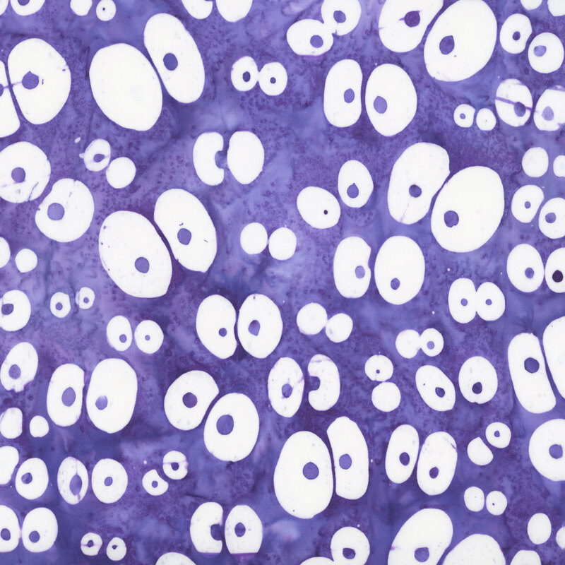 Violet batik with a scattered pattern of large white googly eyes.