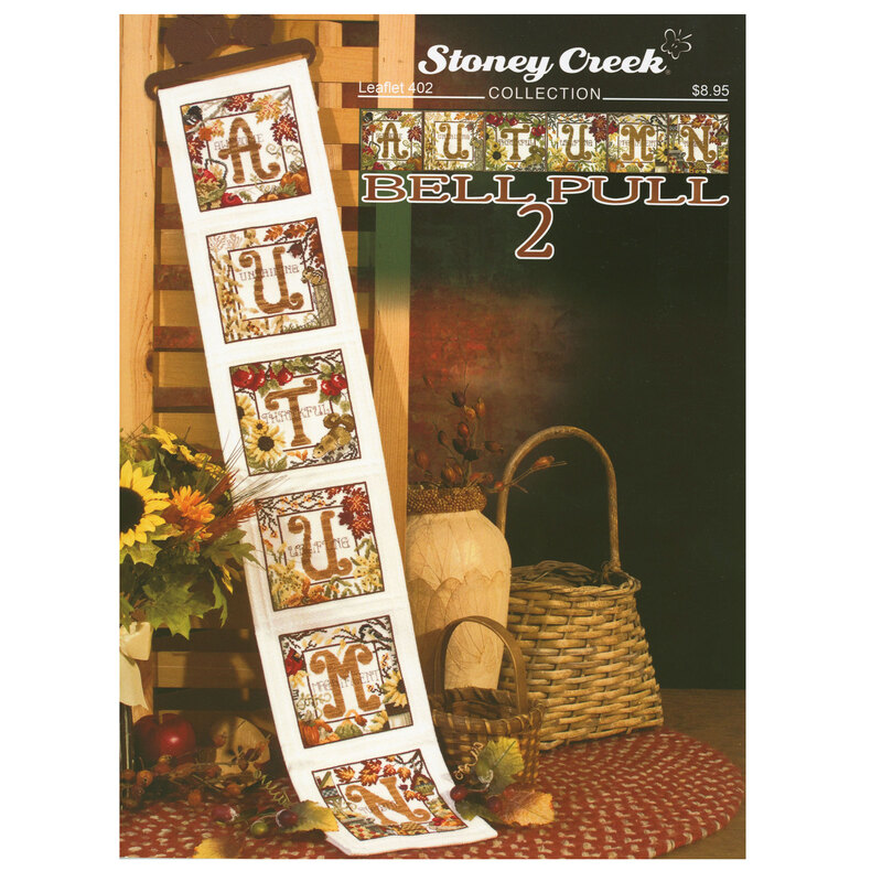 Front cover of the pattern showing the completed banner staged on an autumnal background.