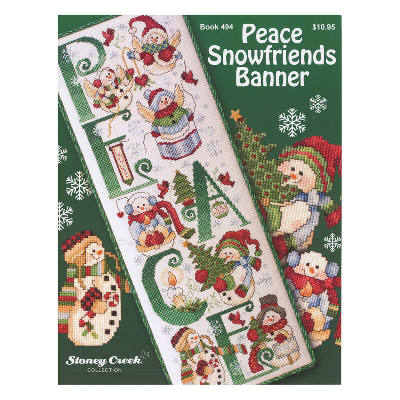 Front cover of the cross stitch pattern with the finished banner staged on a green background.