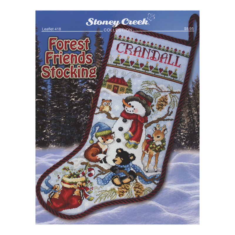 Front cover of the pattern booklet showing the finished stocking displayed on a winter forest background.
