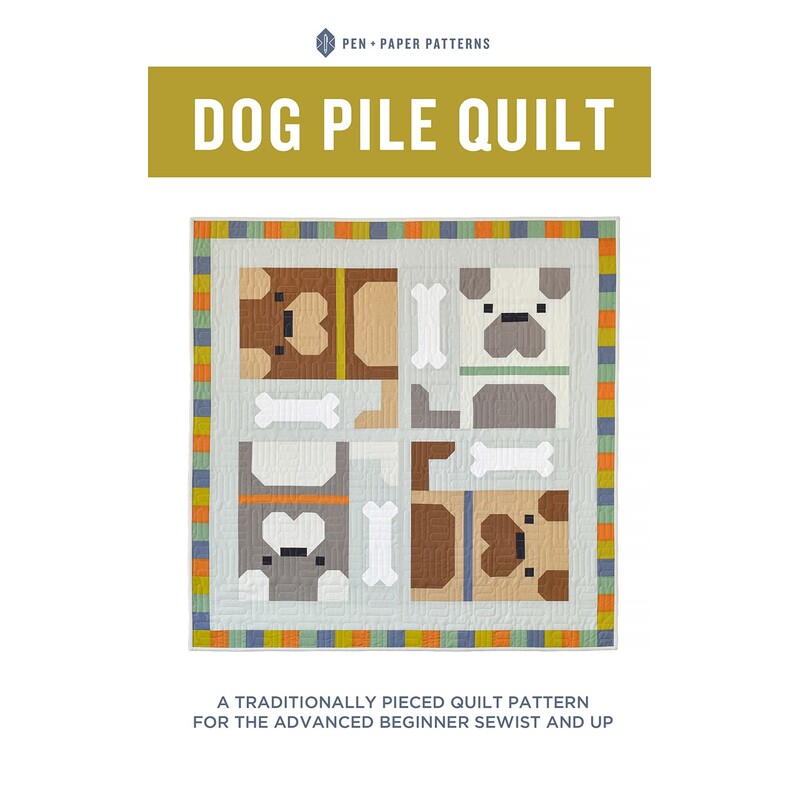 front cover of the Dog Pile Quilt featuring the a quilt with 4 dogs, dog bones, and a colorblock border.