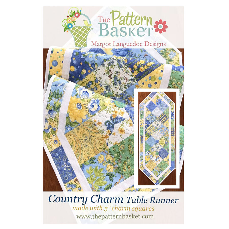 front of the Country Charm Table Runner pattern featuring a blue, yellow, green and white patchwork table runner.