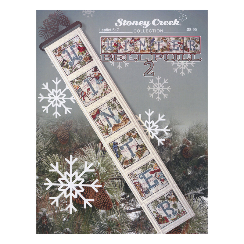 Front cover of the cross stitch pattern with the finished banner staged on a Christmas tree background.
