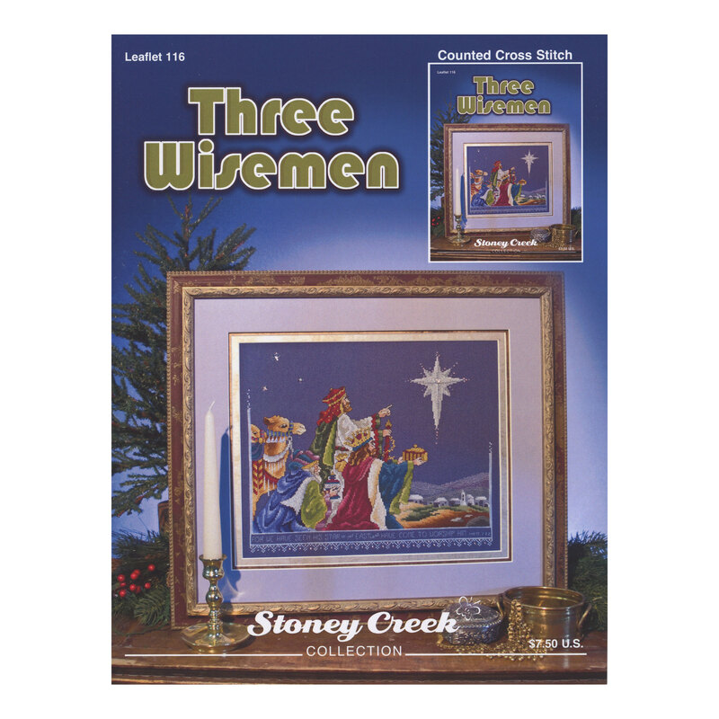 Front cover of the cross stitch pattern with the finished design framed and staged on a tabletop.