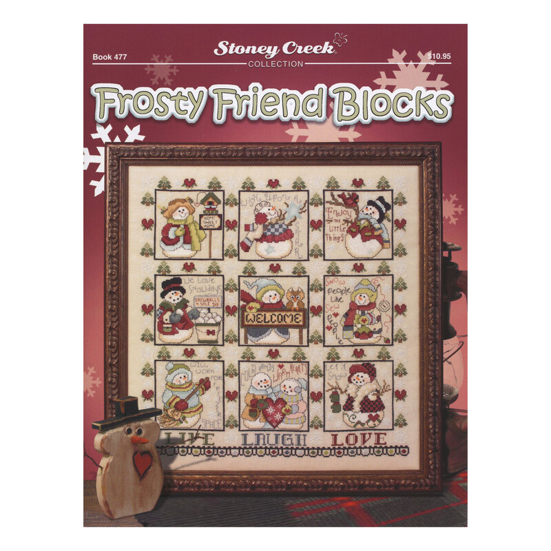 Front cover of the cross stitch pattern with the finished project staged on a red background.