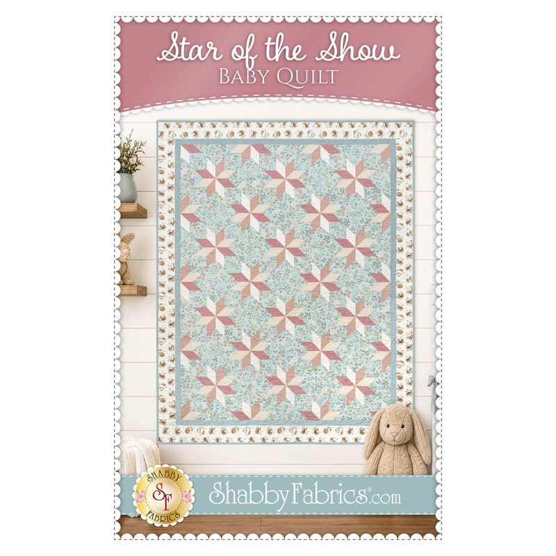 Front cover of the "Star of the Show" baby quilt with pastel star pattern in blue, pink, and cream.