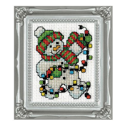 The completed Snowman Lights cross stitch kit framed in the included frame. 