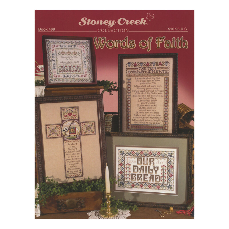 Front cover of the Words of Faith cross stitch pattern book with all the finished patterns in ornate frames in a quaint, wooden table backdrop.