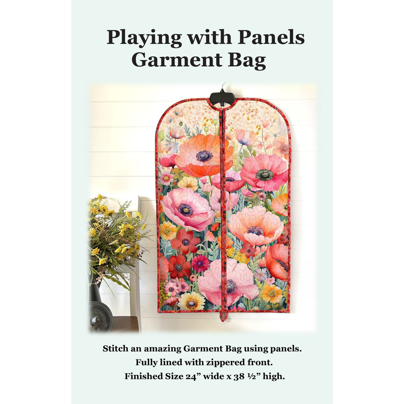 Front cover of the pattern showing the completed project colored in a vibrant poppy themed panel, staged on a hanger against a white shiplap wall with coordinating flowers.