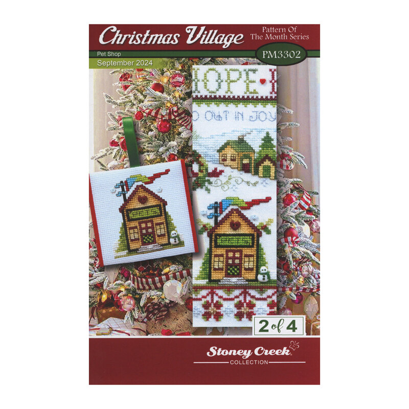 Front cover of the Christmas Village - Pet Shop cross stitch pattern with the finished full design and the ornament version isolated on a Christmas tree back drop.