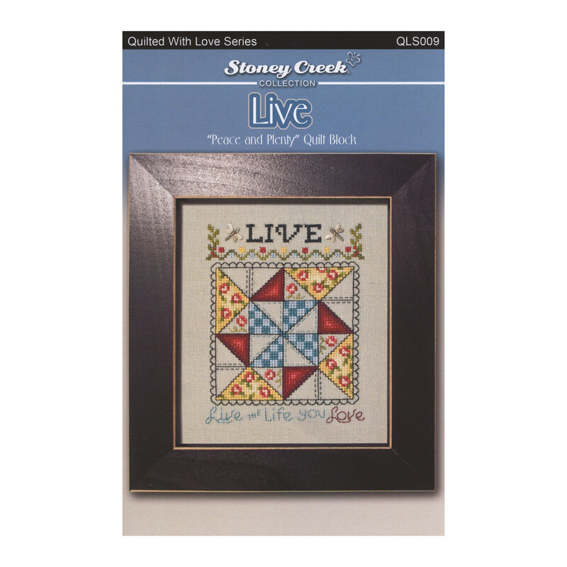 Front of cross stitch pattern showing the finished Quilted With Love Series Live design displayed in a frame.