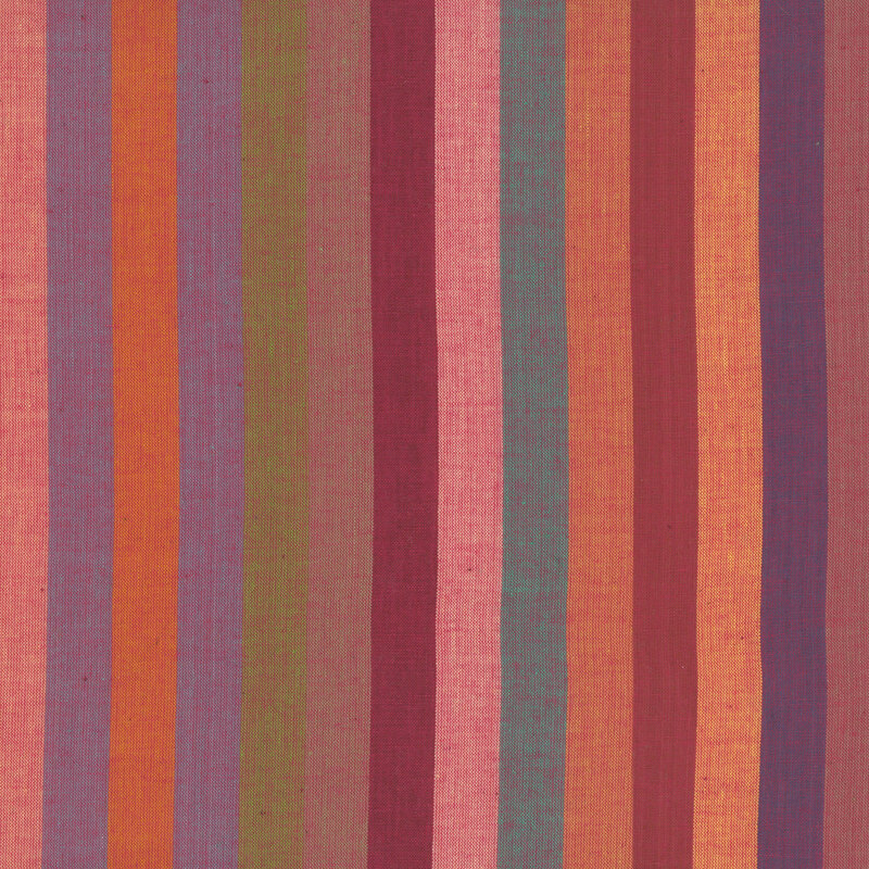woven fabric featuring broad vertical stripes in warm hues of red, pink, peach, and purple.