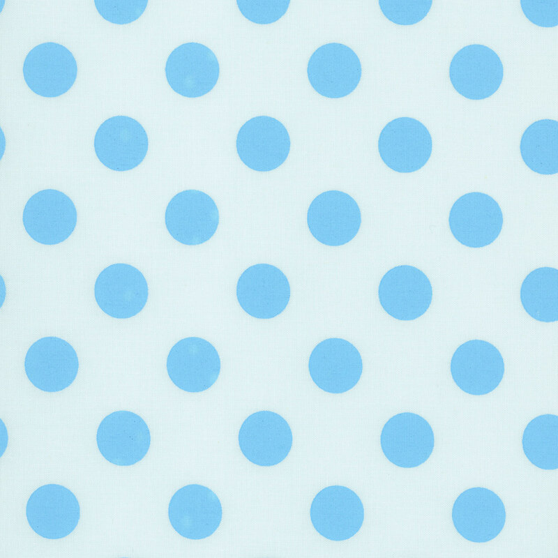 Light sky fabric adorned with a pattern of large, vibrant blue polka dots.