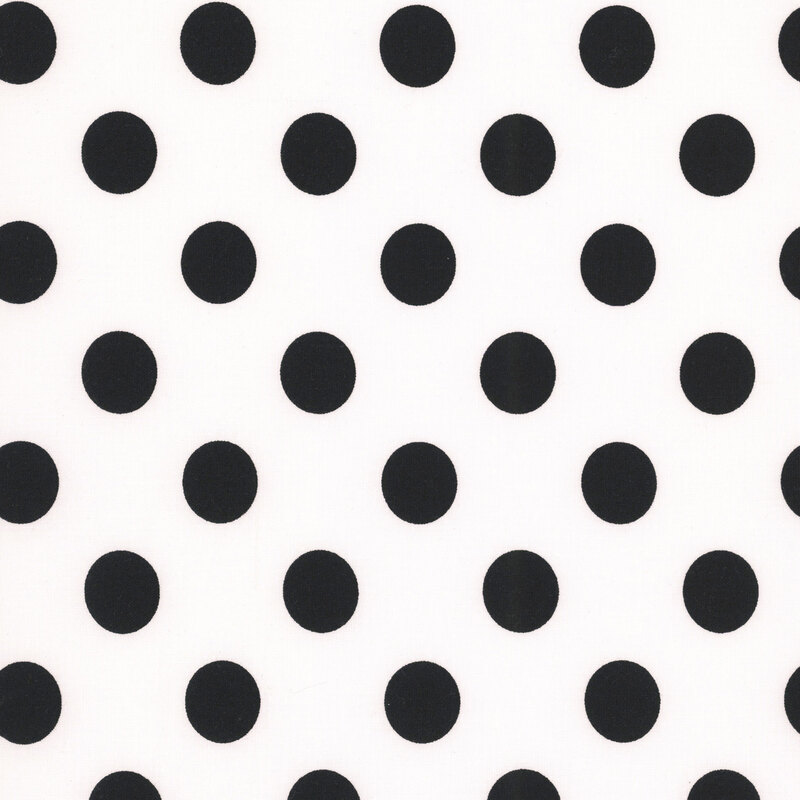 White fabric adorned with a pattern of large black polka dots.