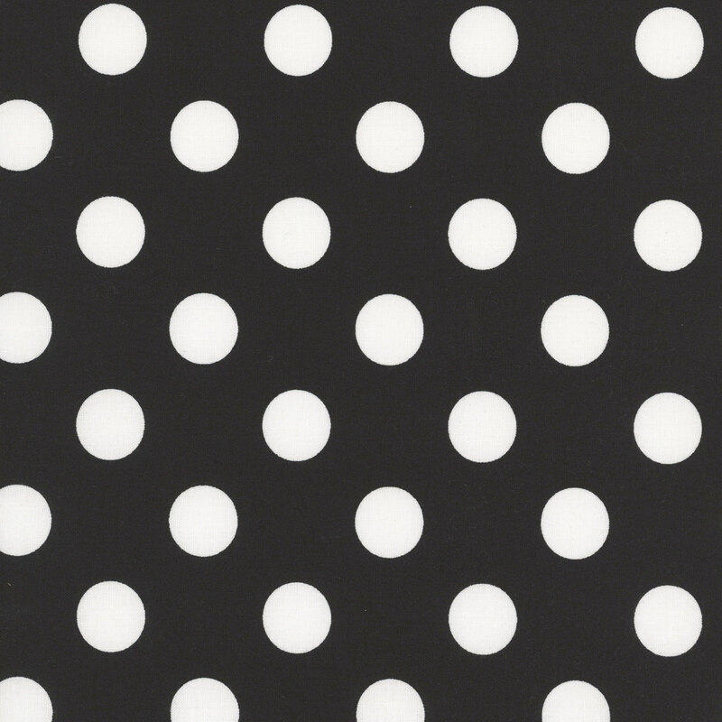 Black fabric adorned with a pattern of large white polka dots.