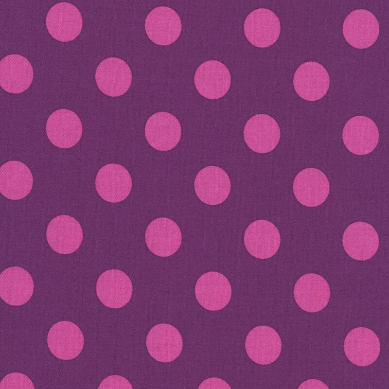 Purple fabric adorned with a pattern of large, vibrant violet polka dots.