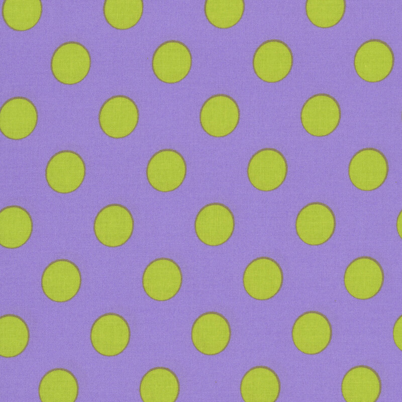Purple fabric adorned with a pattern of large green polka dots.